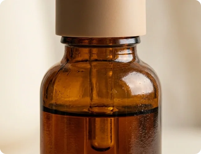 Close crop of an amber skincare bottle with crisp packaging detail